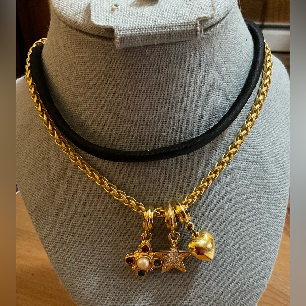 Carolee:3 gold plated charms w/ velvet black cord n a gold toned necklace (5)set